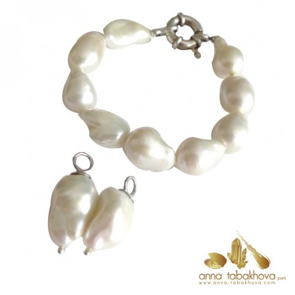 Earrings matched to white pearl necklace
